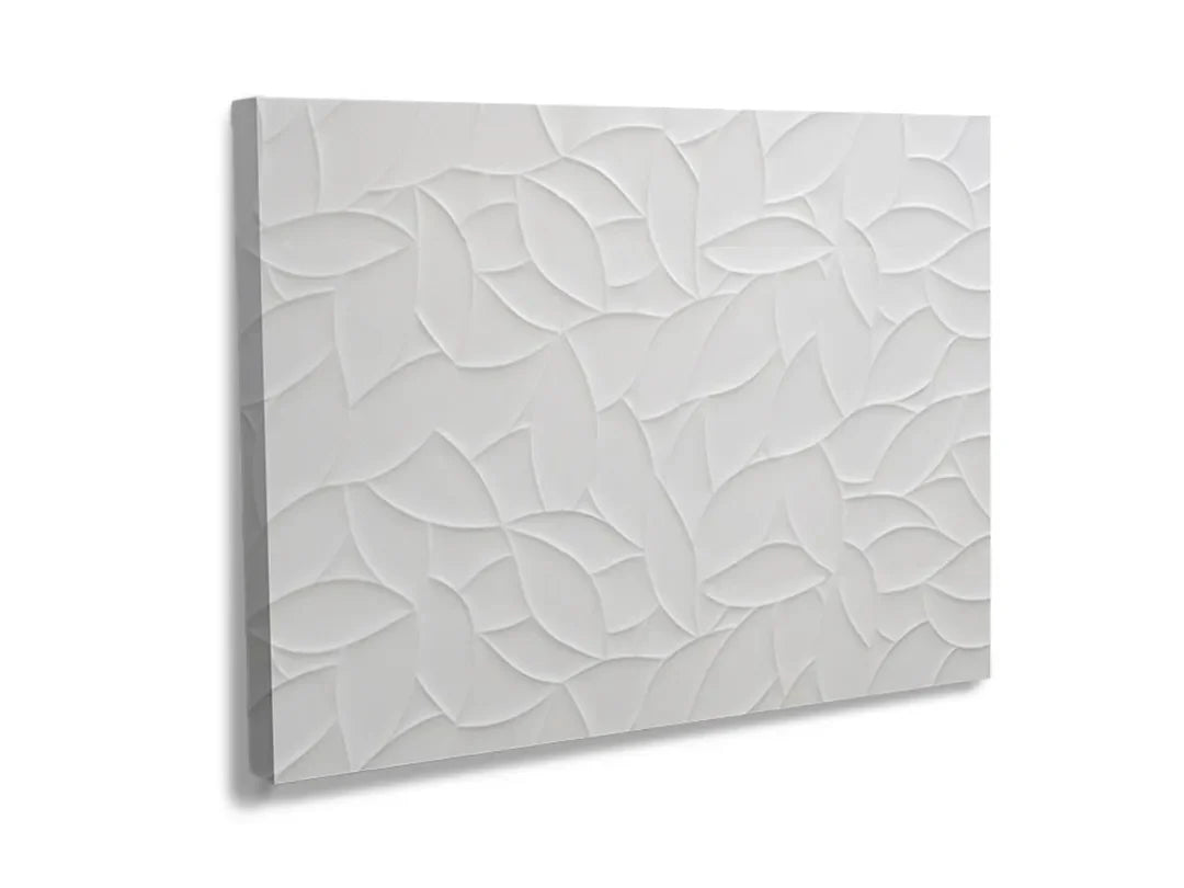 Metalen magneetbord met een elegant bladmotief in reliëf.