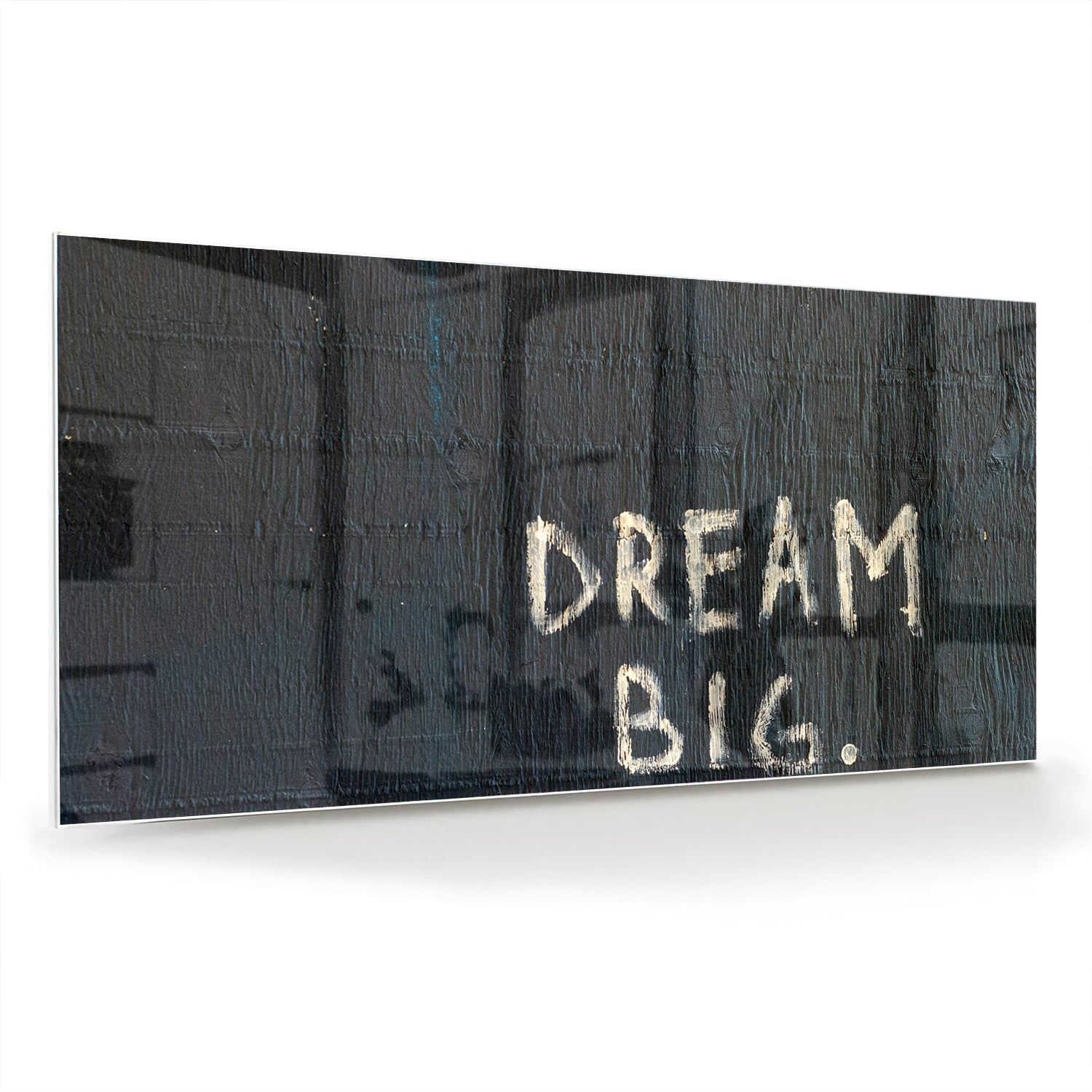 Glas schilderij met tekst 'DREAM BIG' in modern interieur