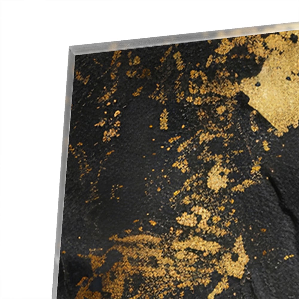 Modern glazen schilderij met abstracte gouden spatten op een zwarte achtergrond.