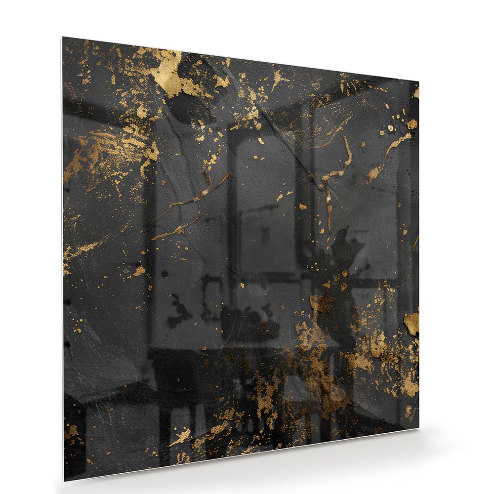 Modern glazen schilderij met abstracte gouden spatten op een zwarte achtergrond.