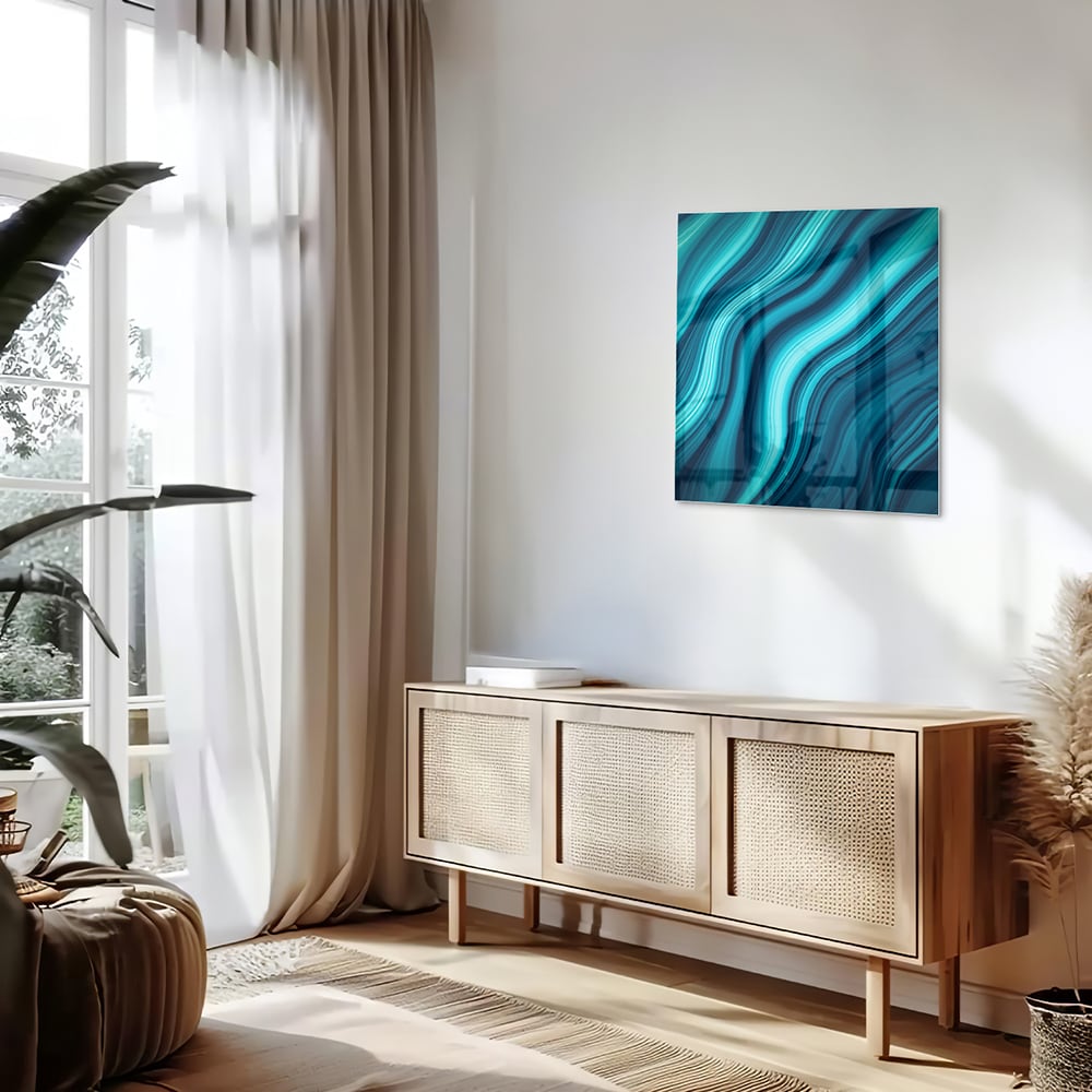 Moderne glazen schilderij met blauwe en groene golven aan de muur