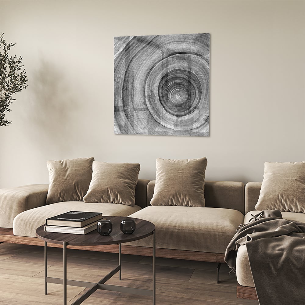 Abstract glazen schilderij in grijstinten met cirkels aan de muur