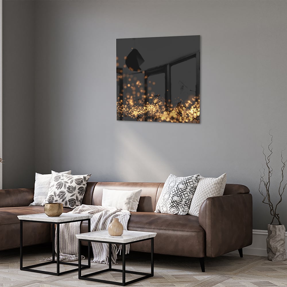 Glazen schilderij met gouden lichtpuntjes op een zwart vlak, ideaal voor moderne interieurs.