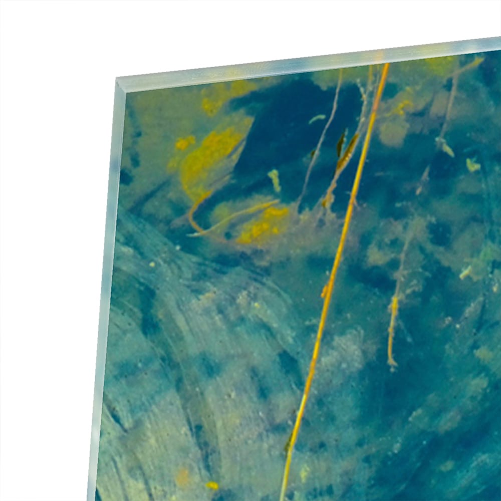 Abstract glazen schilderij met blauw en geel dat aan de muur hangt