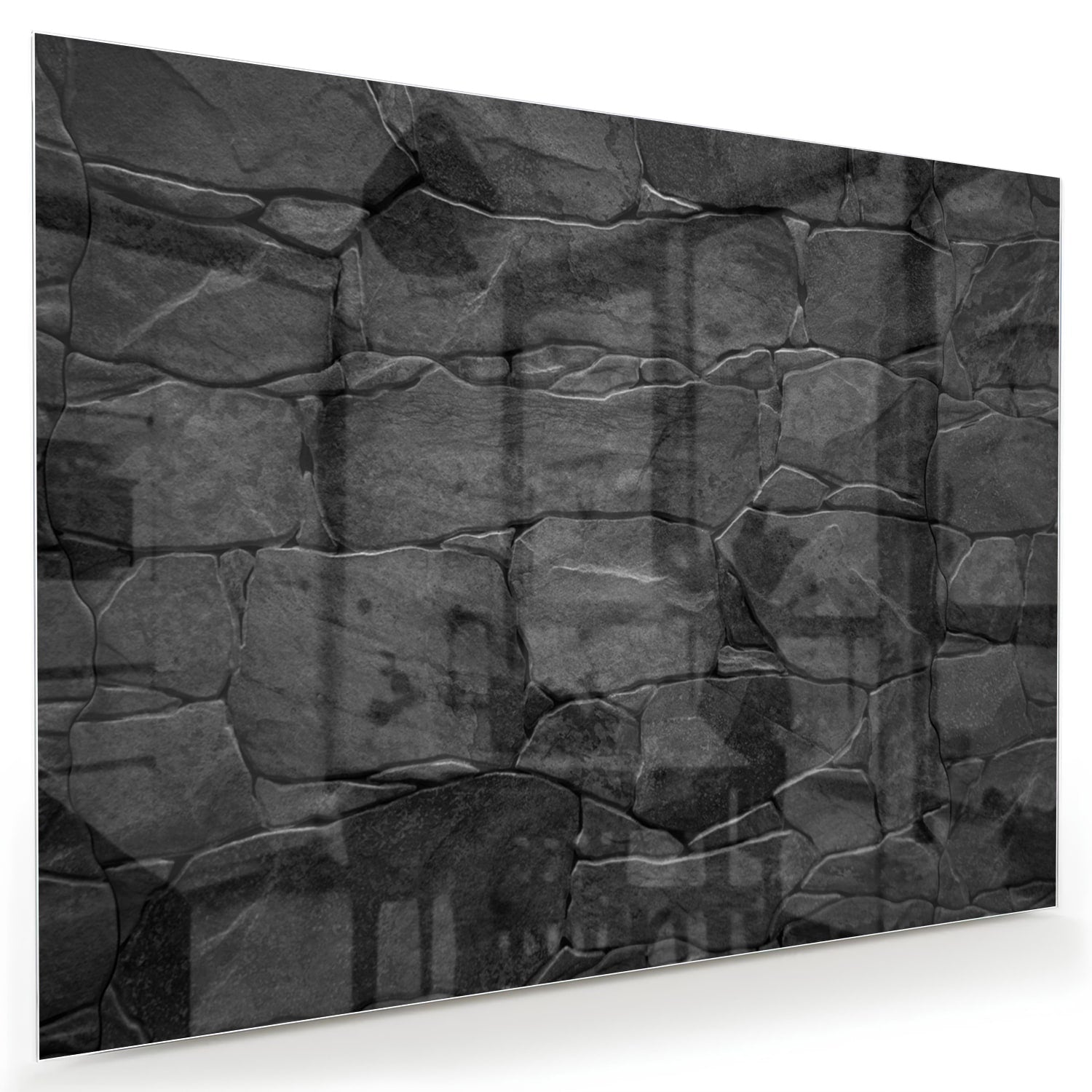 Moderne glazen schilderij in zwart en grijs hangt aan de muur.