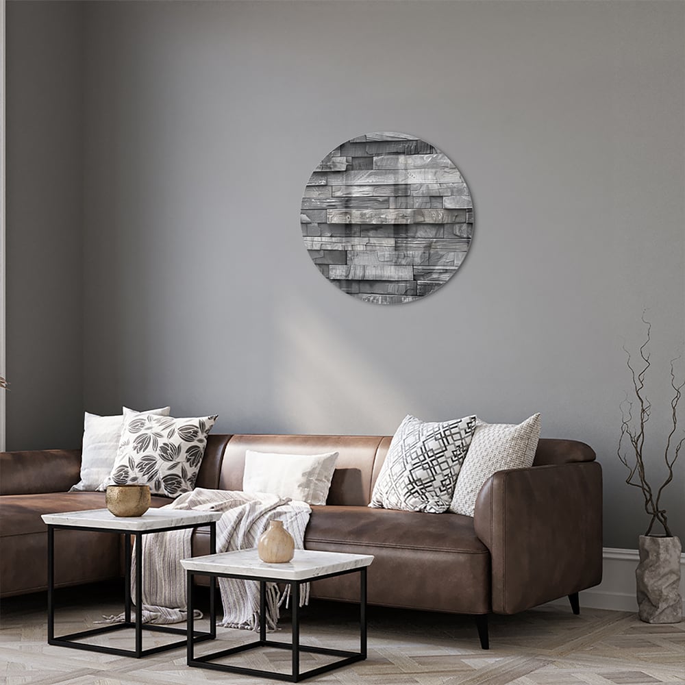 Moderne glazen schilderij met grijze texturen aan een lichte muur.
